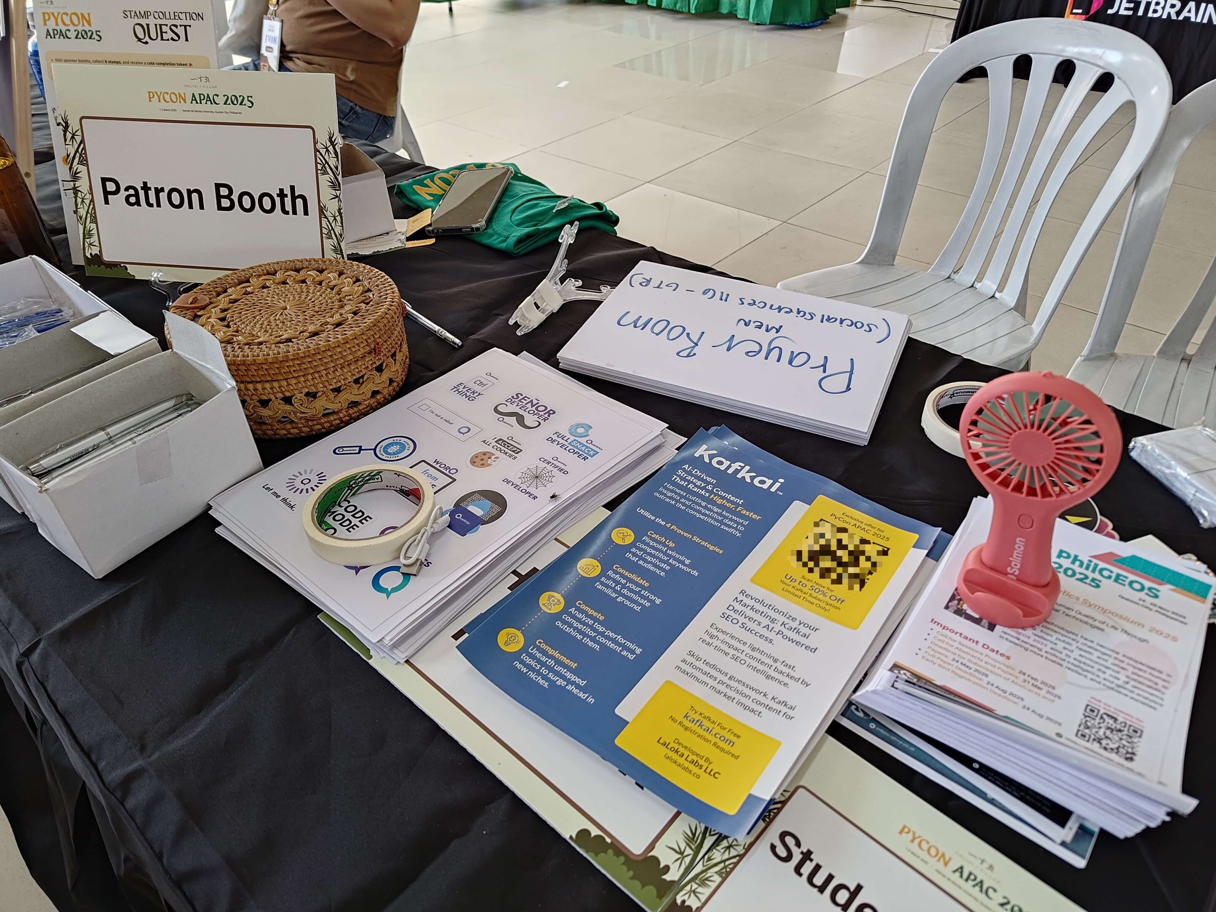 afkai marketing flyers and promotional materials laid out on a table at the PyCon APAC 2025 patron booth.